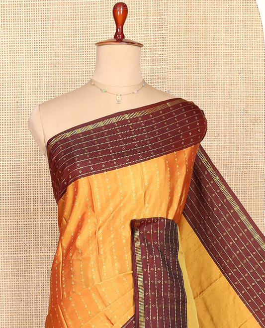 Yellow Aarani Silk Saree, Lightly Embellished with Zari Buttas All Over Its Body, Complemented by a Contrast Zari Design Border, Pallu of Stripes, and Paired with a Matching Blouse
