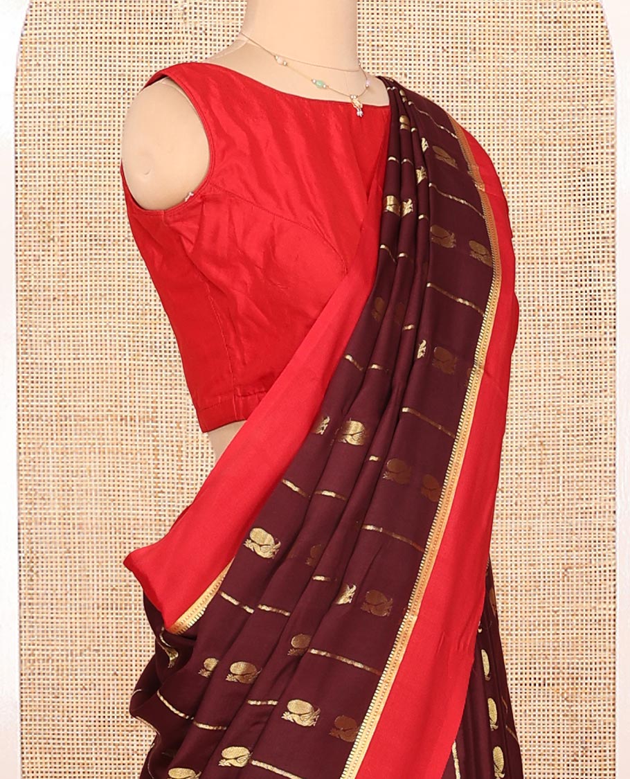 Brown Mysore Silk Saree, Ornamented With Zari Stripes and Peacock Buttas Across Its Body, Complemented by Captivating Contrast Border of Traditional Zari Designs, Pallu Steeped with Traditional Zari Designs, and Paired with a Contrast Blouse
