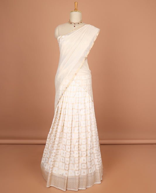 white floral enclosed with checked half saree with self zari design border, zari design blouse & checked , zari design border dhavani