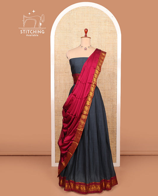 Grey plain cotton half-saree with contrast traditional zari bordered skirt, matching blouse, and a contrast elephant motifs bordered dhavani