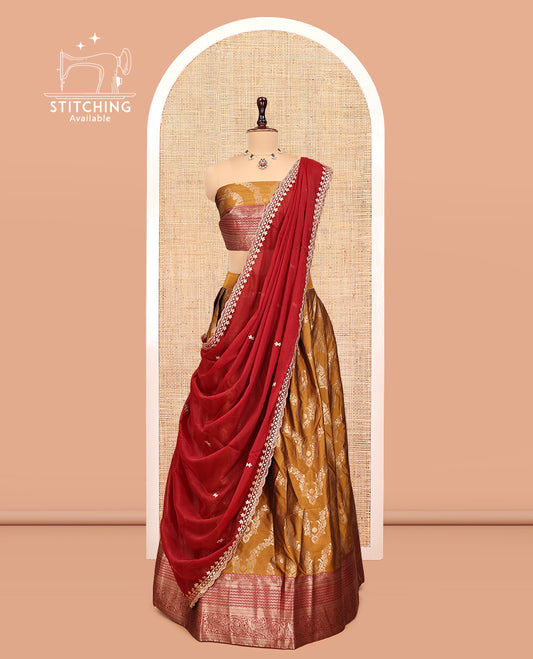 Mustard-Red Banarasi Half-Saree, Accentuated with Jacquard Design, a Contrast Traditional Zari Border, a Matching Blouse, and a Contrast Embroidered Dhavani