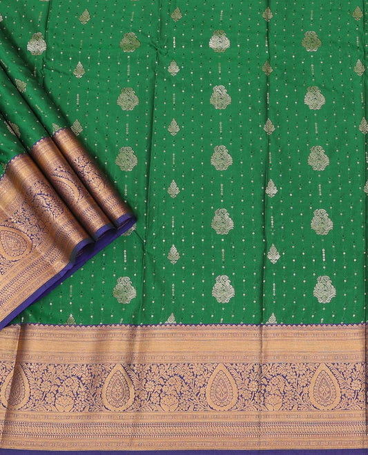 Green Art Silk Pavadai Material Set, Accentuated with Embossed and Zari Buttas All Over the Skirt, Complemented by a Contrast Traditional Zari Woven Border, and Paired with a Contrast Blouse