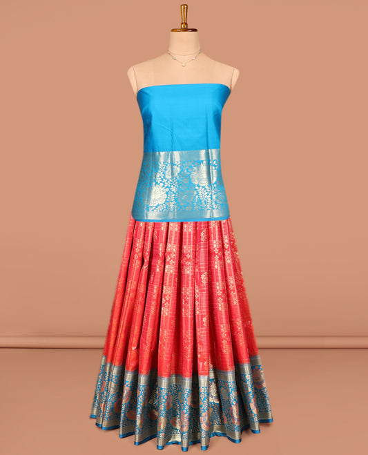 Red Art Silk Pavadai Material Set, Delicately Woven with Zari Buttas and Checks on Its Skirt, Complemented by a Contrast Floral Zari Design Border, and Paired with a Contrast Blouse