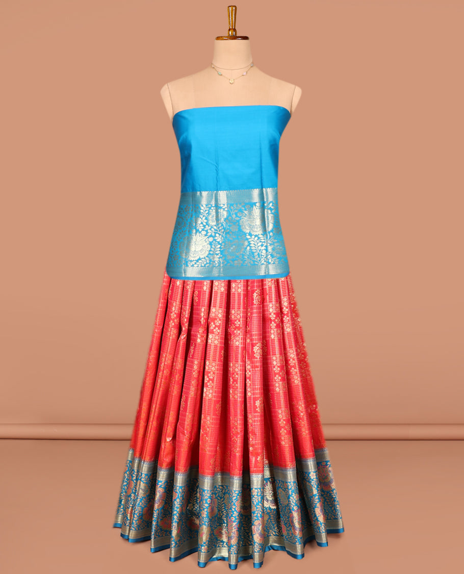 Red Art Silk Pavadai Material Set, Delicately Woven with Zari Buttas and Checks on Its Skirt, Complemented by a Contrast Floral Zari Design Border, and Paired with a Contrast Blouse