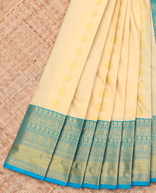Cream Budget Silk Saree, Mesmerized with Zari Buttas on Its Body, Complemented by a Contrast Traditional Zari Design Border, Pallu of Ogee Patterns, and Paired with a Contrast Blouse