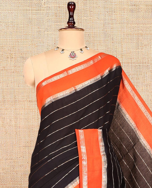 Black Assam Silk Saree, Charmingly Accented with Zari Stripes, Complemented by a Contrast Zari Traditional Border, Zari-Striped Pallu, and a Contrast Blouse