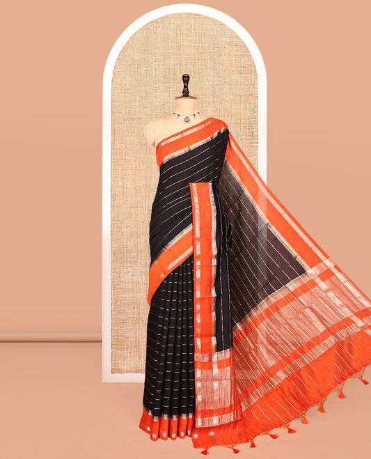 Black Assam Silk Saree, Charmingly Accented with Zari Stripes, Complemented by a Contrast Zari Traditional Border, Zari-Striped Pallu, and a Contrast Blouse