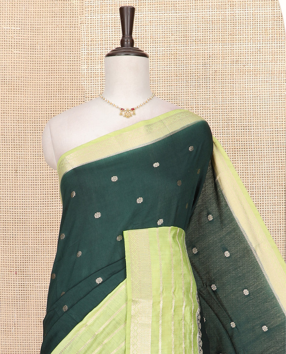 Dark Green Assam Silk Embellished with Floral Zari Buttas, Complemented by Contrast Traditional Zari Design Border, a Gleaming Pallu of Zari Stripes, and Paired with a Contrast Blouse