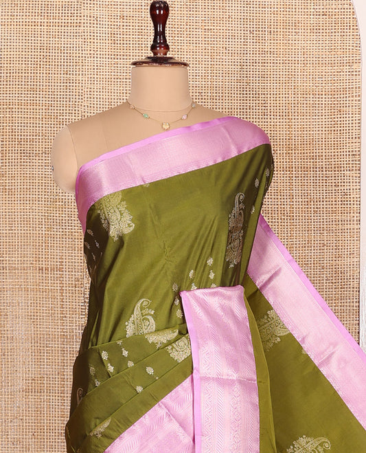 Green Budget Silk Saree, Accentuated with Floral-Paisley Zari Buttas All Over Its Body, Complemented by a Contrast Border of Traditional Designs Woven in Zari, Intricately Designed Pallu, and Paired with a Contrast Blouse