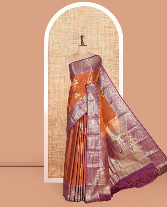 Orange Budget Silk Saree, Elegantly Highlighted with Zari Buttas on Its Body, Complemented by a Contrast Traditional Zari Design Border, Mughal-Style Zari Woven Pallu, and Paired with a Contrast Blouse