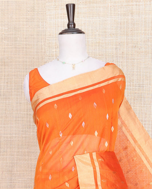 Orange Chanderi Cotton Saree, Decked Up with Buttas All Over Its Body, Highlighted by a Zari Border, Contrast Pallu Steeped with Floral Buttas, and Paired with a Contrast Blouse