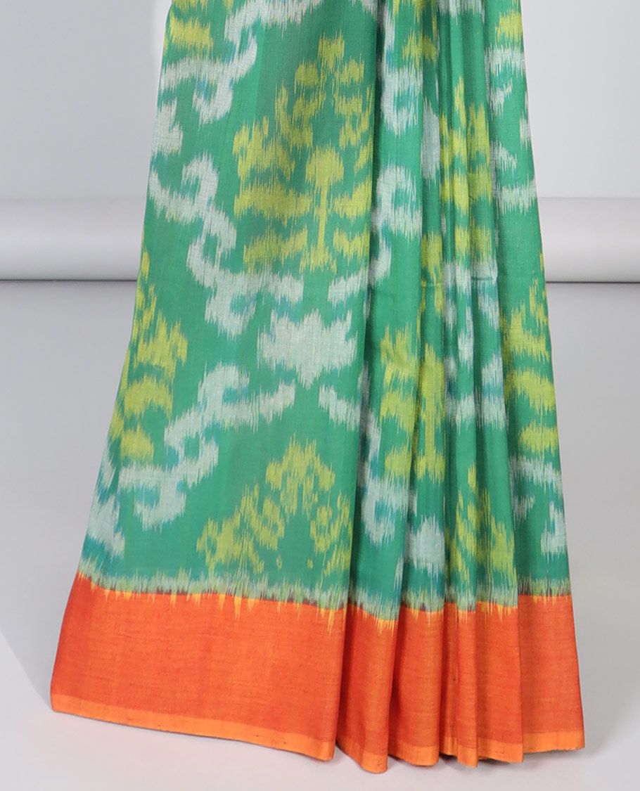 Green argyle design ikkat cotton saree with contrast plain border & intricate design pallu