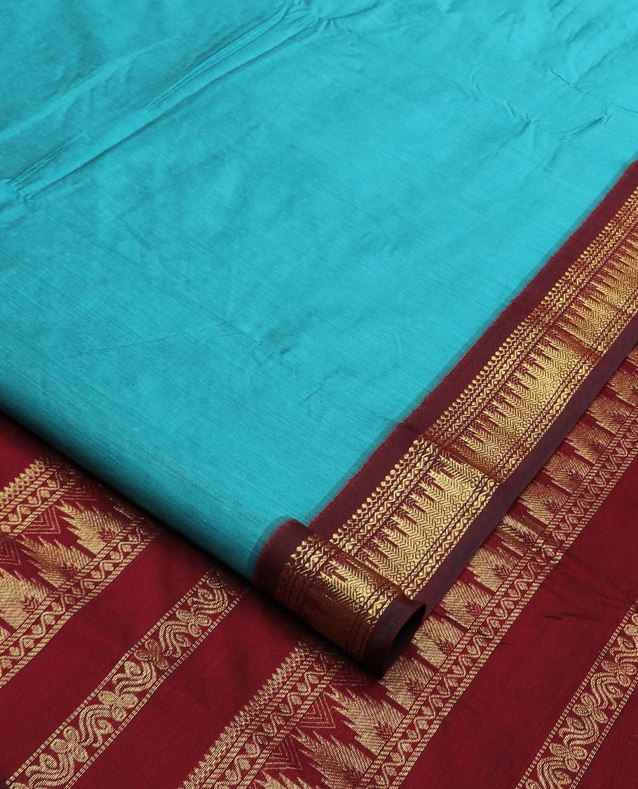 Blue buttas nine-yard cotton saree, contrast traditional zari border, and pallu steeped with traditional motifs