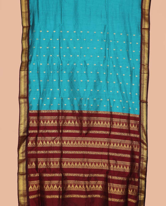 Blue buttas nine-yard cotton saree, contrast traditional zari border, and pallu steeped with traditional motifs