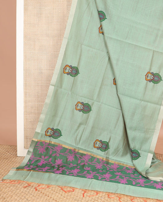 Pale green kalamkari buttas printed chirala cotton saree, bavanji border, and contrast floral vine print pallu
