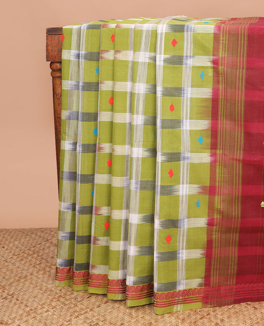 Green buttas and checked Andhra cotton saree, paisley border, and contrast pallu of stripes and buttas