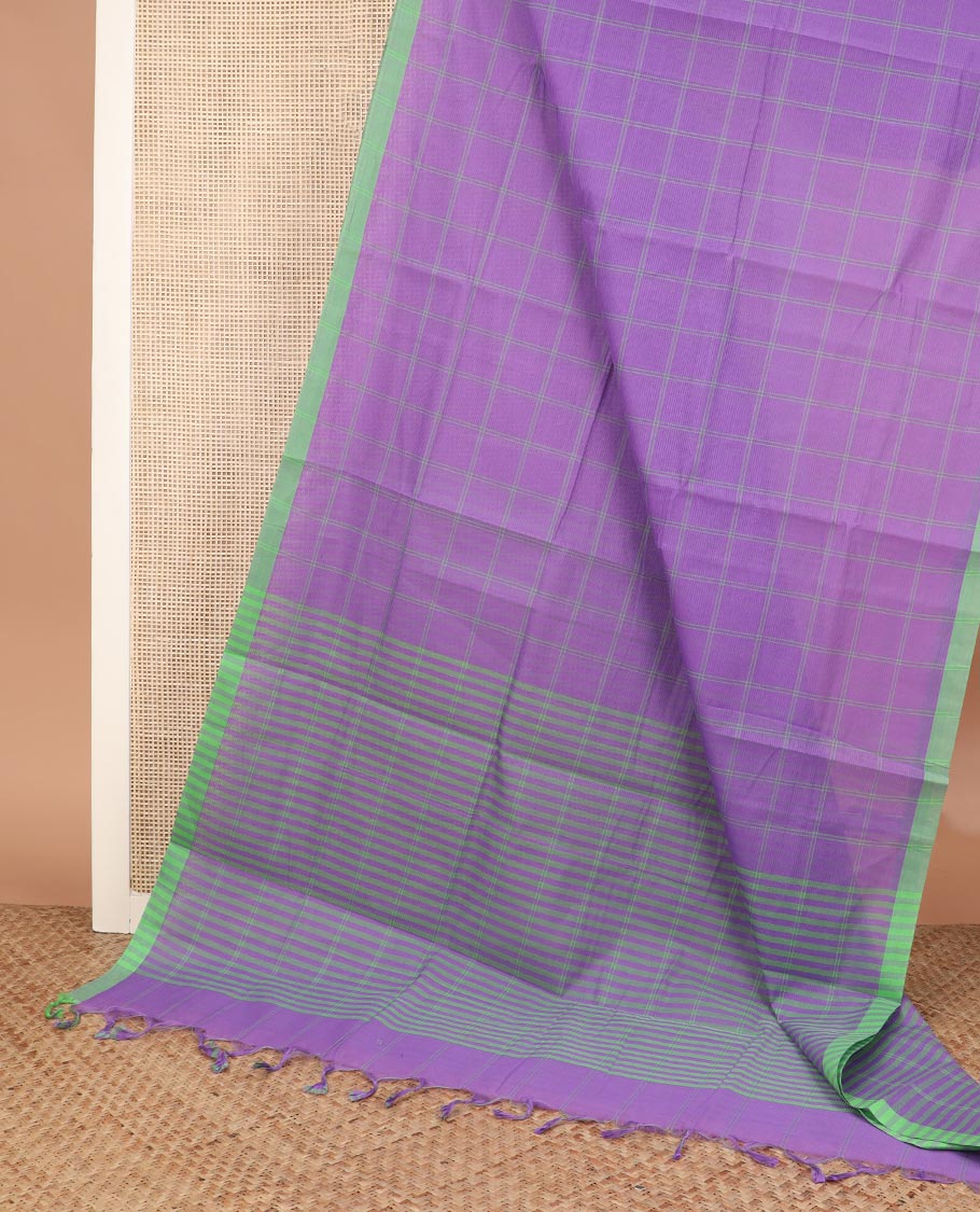 Purple checked Mangalagiri cotton saree with contrast border, striped pallu, and a contrast kalamkari floral printed blouse