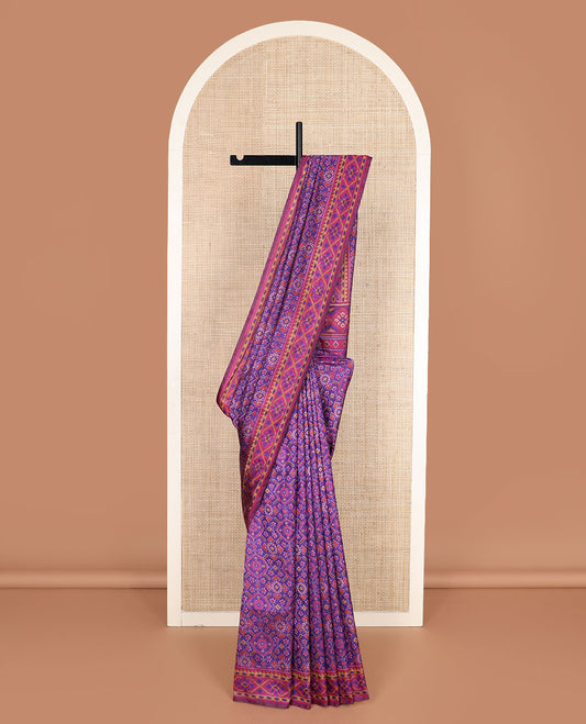 Violet intricately ikkat woven semi-banaras patola silk saree, diamond patterned border, and diamond patterned pallu