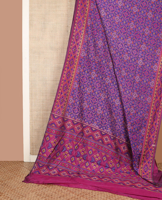 Violet intricately ikkat woven semi-banaras patola silk saree, diamond patterned border, and diamond patterned pallu