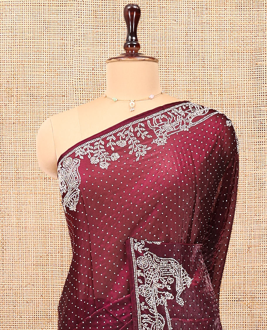 Wine Designer Saree, Scintillated with Stone Struck All Over Its Body, Highlighted by Intricate Stone Work Border, and Paired with a Matching Blouse