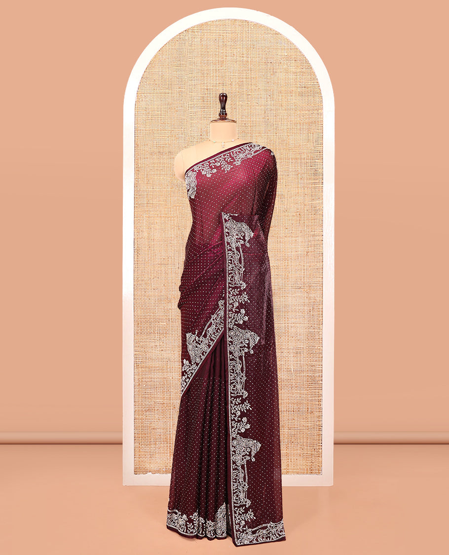 Wine Designer Saree, Scintillated with Stone Struck All Over Its Body, Highlighted by Intricate Stone Work Border, and Paired with a Matching Blouse