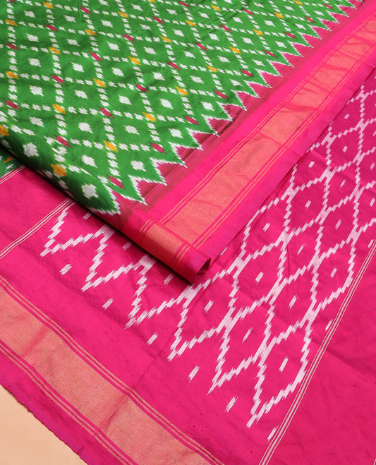 Green Ikkat Silk Saree with Ikkat Buttas Enclosed Jaal Design, Spotlighted with a Contrast Temple Border, Pallu Features Ikkat Jaal Patterns, and with a Contrast Blouse