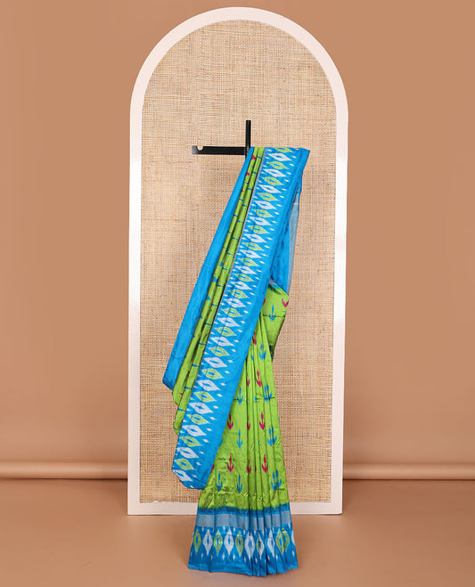 Green ikkat saree with ikkat buttas, contrast ikkat border & pallu of ikkat jaal design