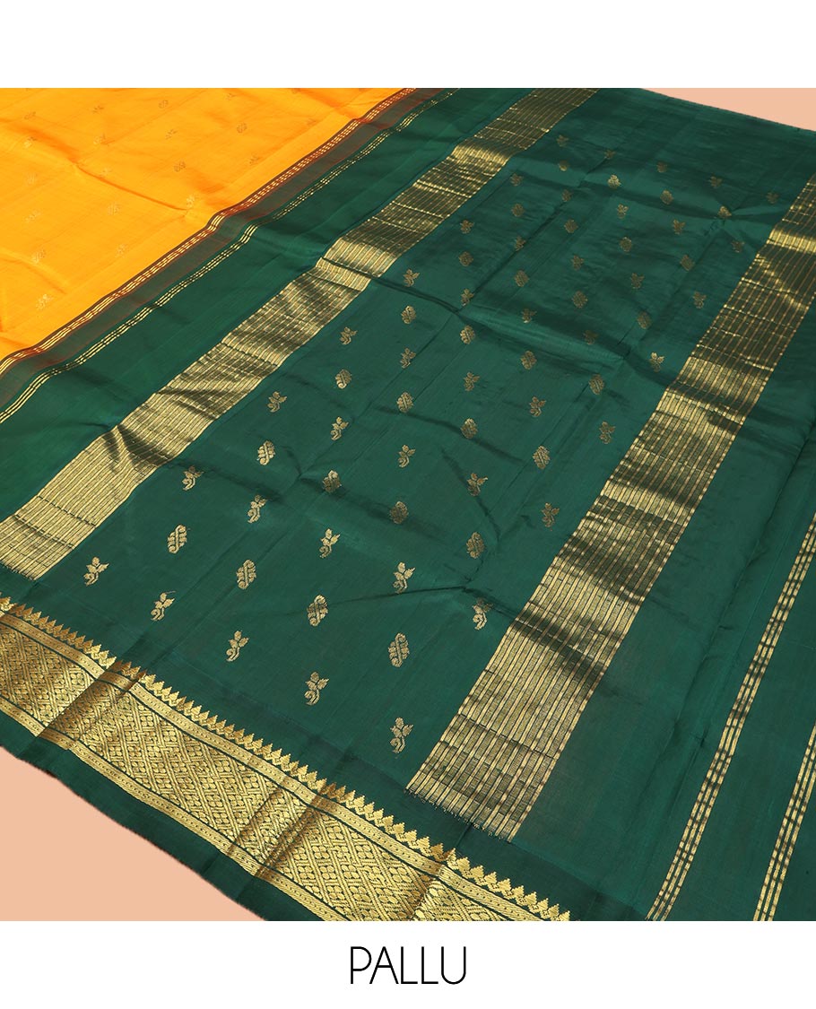 Yellow Kanchipuram Silk Saree, Sparsely Sparkled with Zari Buttas on Its Body, Complemented by a Contrast One-Sided Korvai Border of Thilakam Mokku, Banaras, Muthu, and Kamalam Designs, Pallu Features Zari Designs, and Comes Without a Blouse