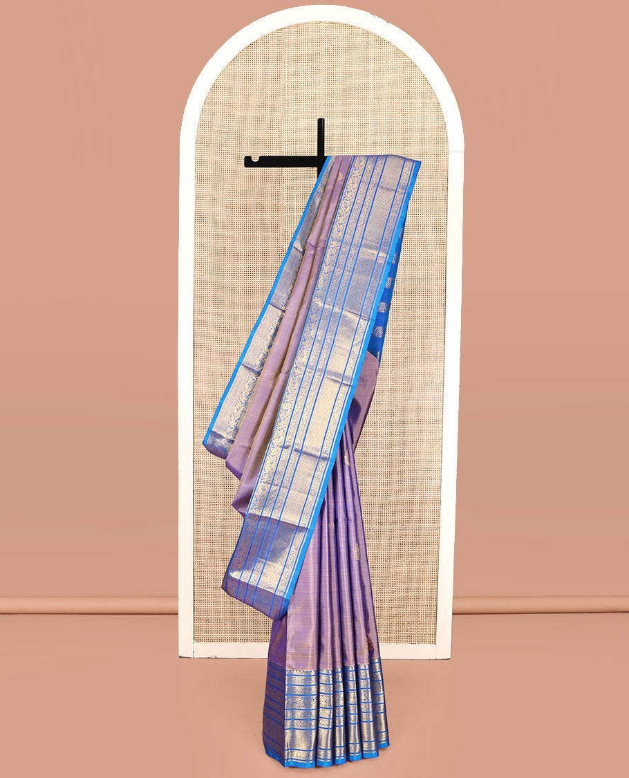 Blue Dual-Tone Kanchipuram Silk Saree, Detailed with Zari Buttas All Over Its Body, Complemented by a Contrast Border of Thilakam Mokku, Kodi Visiry, Mayil, and Kuyil Kann Designs, Grand Pallu of Kodi Visiry Designs, and Paired with a Contrast Blouse
