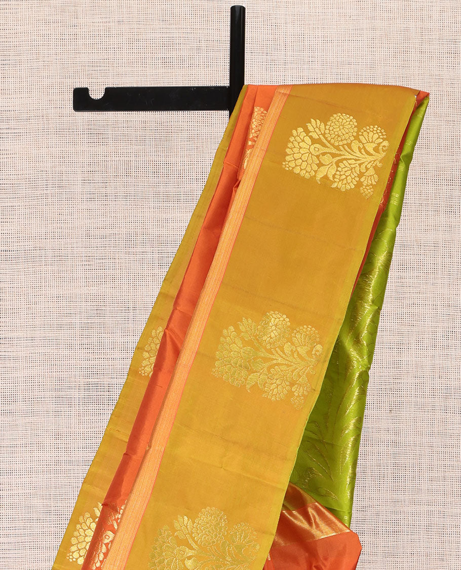 Orange Kanchipuram Silk Saree, Elevated with Floral Zari Buttas, a Contrast Floral Zari Buttas, Grand Floral Pattu, and a Contrast Blouse
