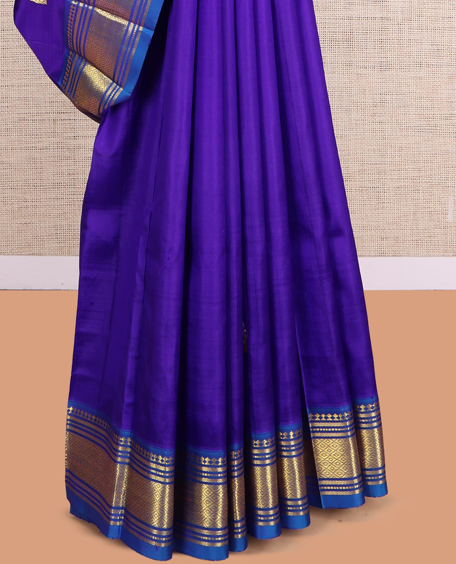 Violet Kanchipuram Silk Saree, Embellished with Zari Buttas, a Contrast One-Sided Border of Paneer Sombu, Banaras, Muthu and Mayil Kann Design, Zari Design Pallu, and No Blouse