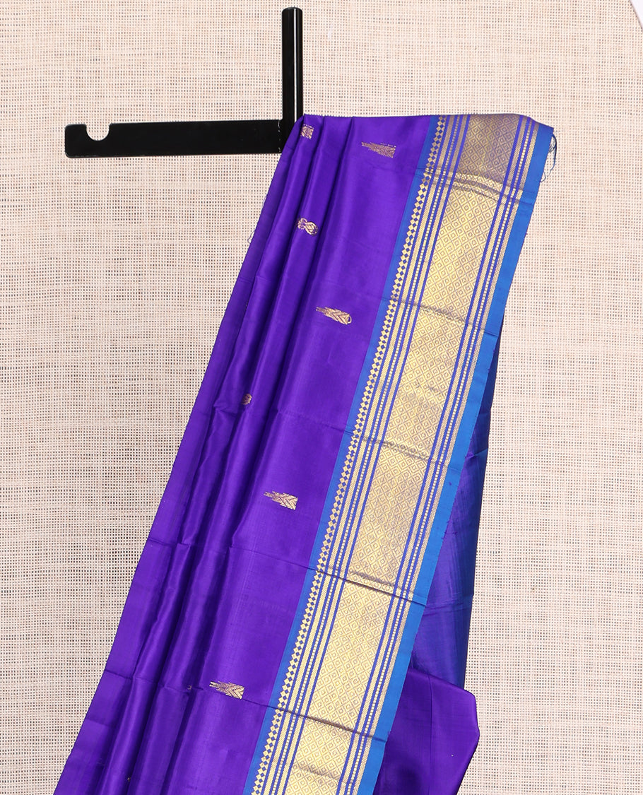 Violet Kanchipuram Silk Saree, Embellished with Zari Buttas, a Contrast One-Sided Border of Paneer Sombu, Banaras, Muthu and Mayil Kann Design, Zari Design Pallu, and No Blouse