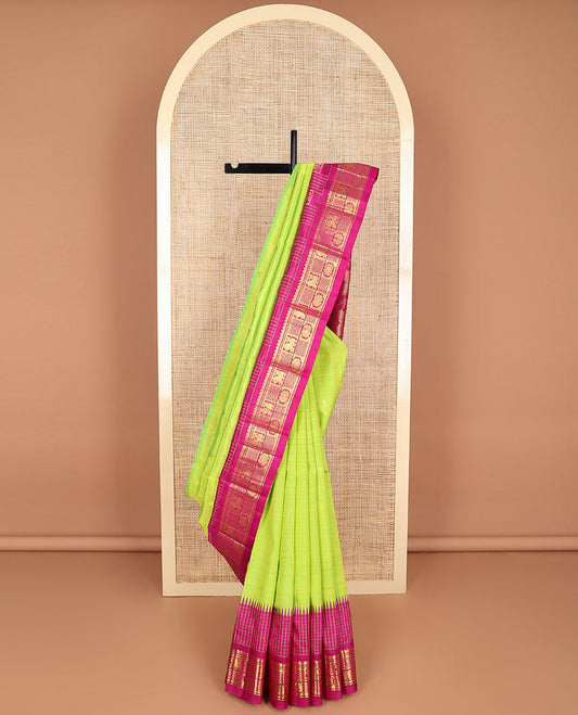 Green floral buttas kancheepuram silk saree with contrast floral design border & intricate zari design pallu