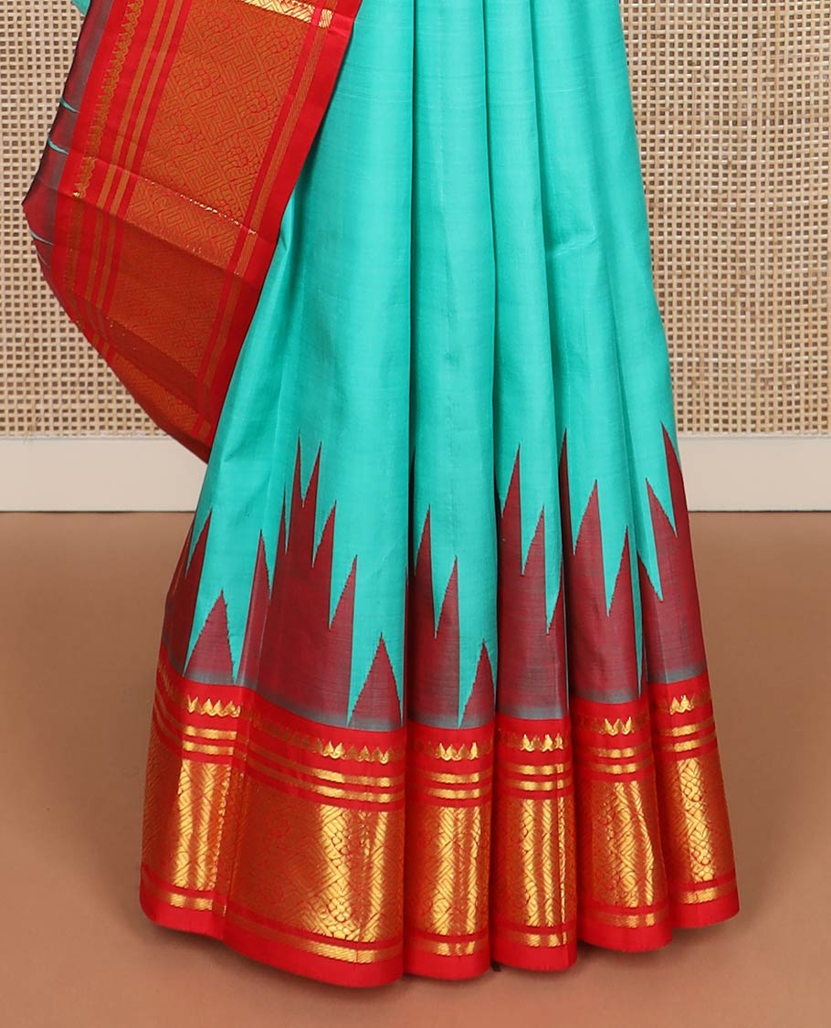 Turquoise yaanai buttas kanchipuram silk saree, contrast thazampoo rekku one-sided border of thilakam mokku,banaras & jaal & butta enclosed jaal pallu