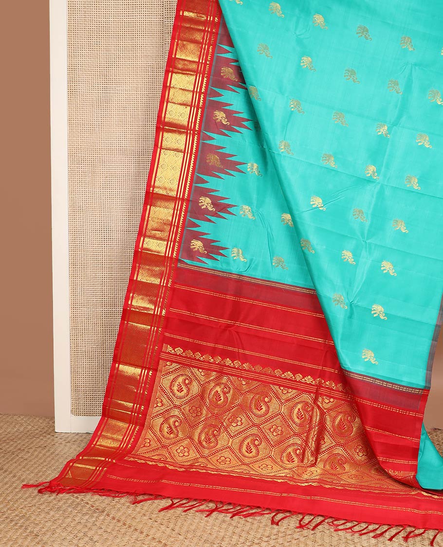 Turquoise yaanai buttas kanchipuram silk saree, contrast thazampoo rekku one-sided border of thilakam mokku,banaras & jaal & butta enclosed jaal pallu