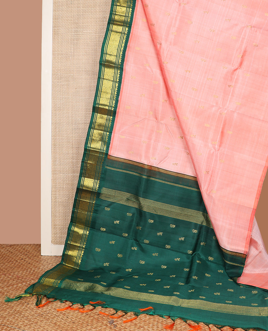 Peach zari buttas Kanchipuram silk saree, contrast one-sided korvai zari design border, and zari design pallu