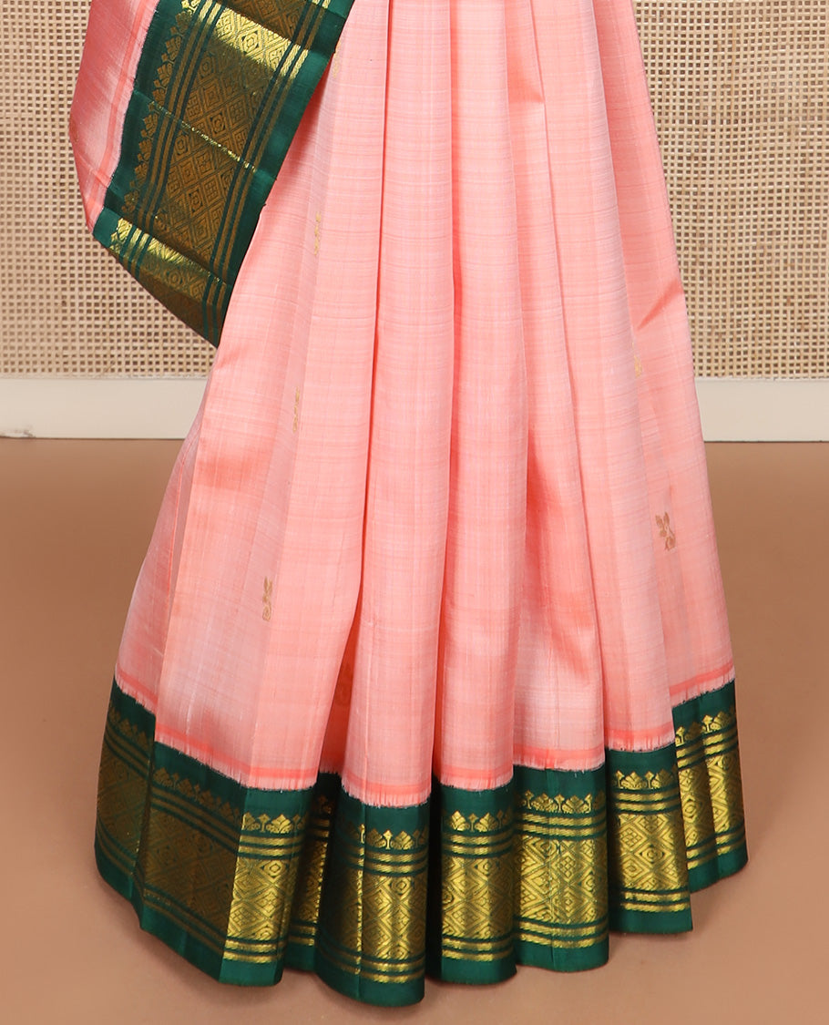 Peach zari buttas Kanchipuram silk saree, contrast one-sided korvai zari design border, and zari design pallu