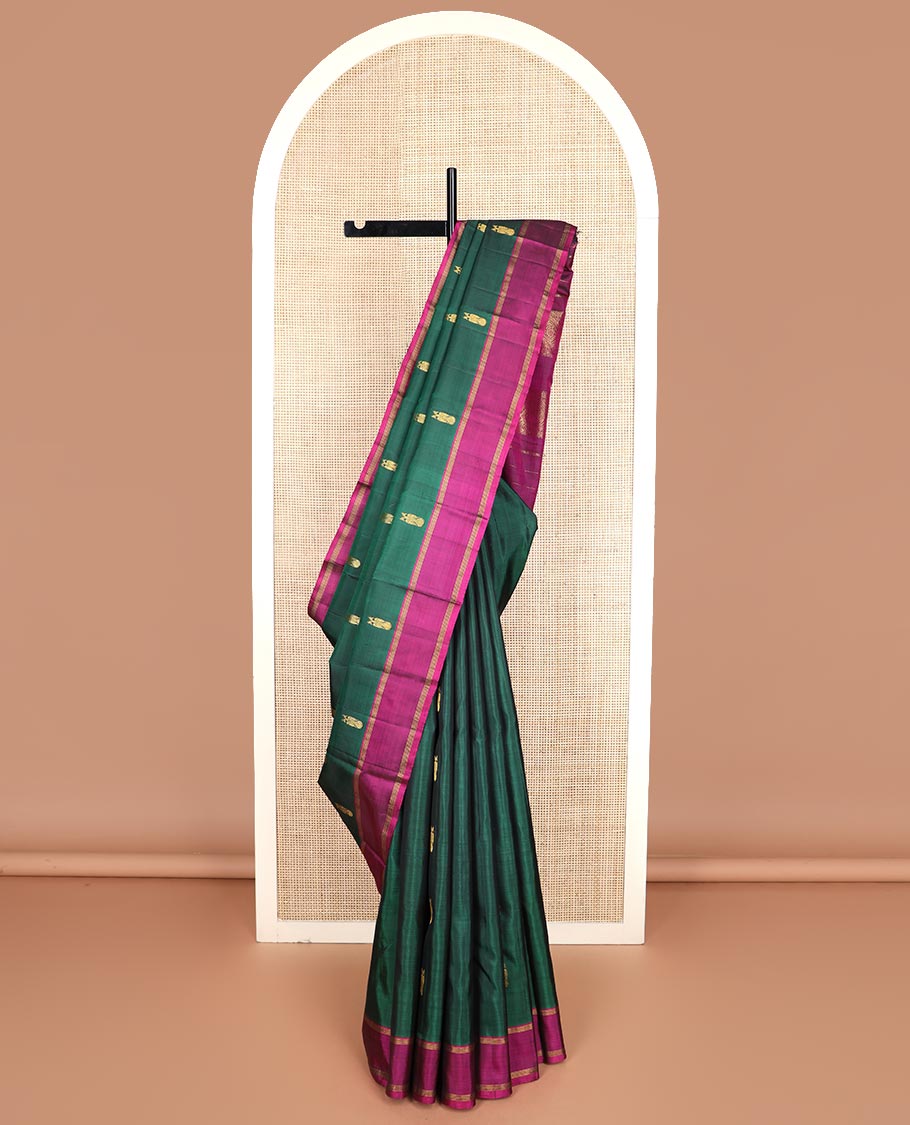 Green iruthalai pakshi buttas Kanchipuram silk saree, contrast rettai pettu border, and pallu of muthu stripes, and arumbu manga designs
