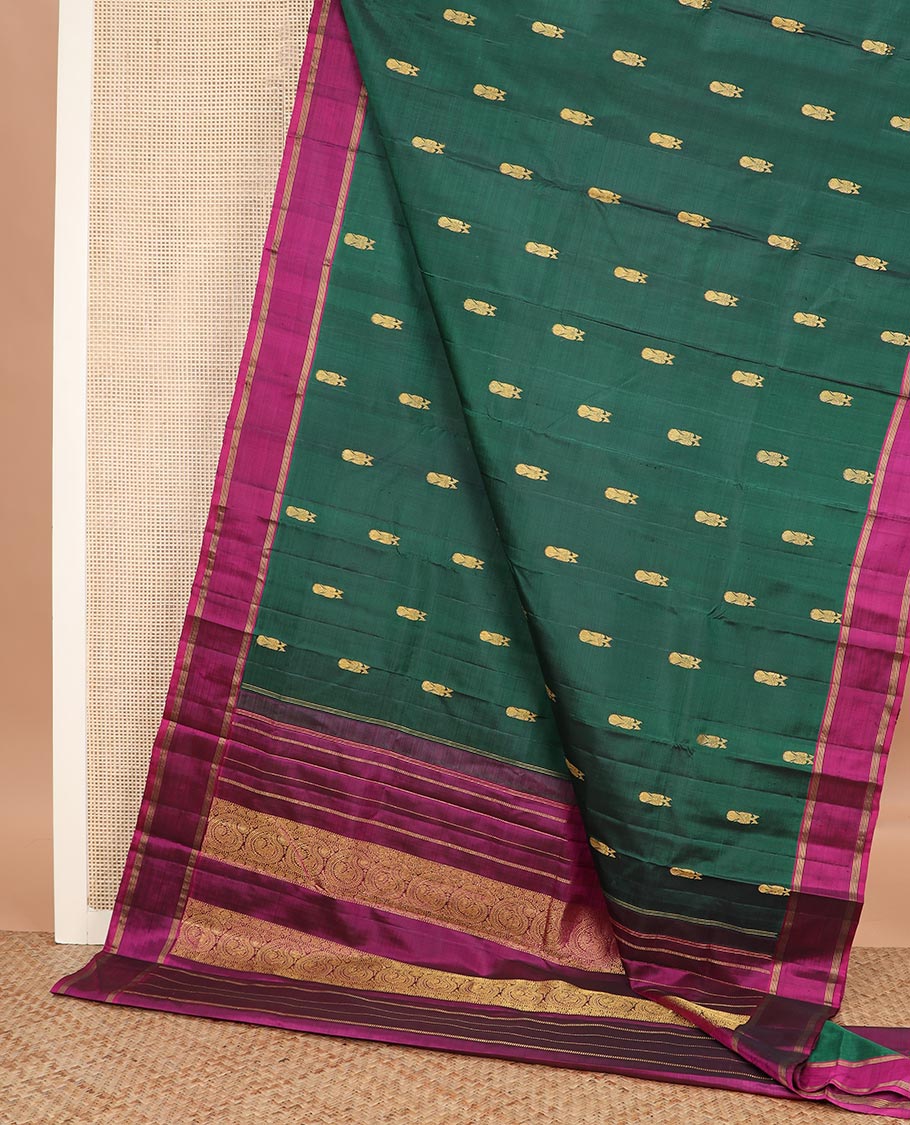 Green iruthalai pakshi buttas Kanchipuram silk saree, contrast rettai pettu border, and pallu of muthu stripes, and arumbu manga designs