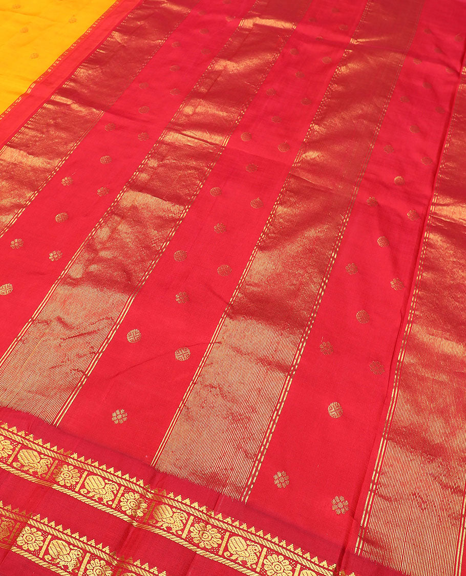 Yellow zari buttas Kanchipuram silk saree, contrast thazampoo rekku border of rekku, banaras, and mayil chakram designs, and zari design pallu