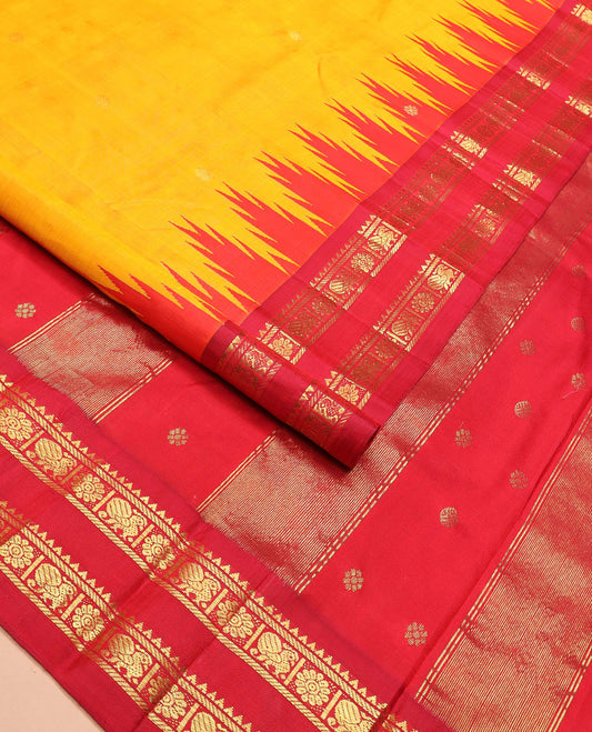 Yellow zari buttas Kanchipuram silk saree, contrast thazampoo rekku border of rekku, banaras, and mayil chakram designs, and zari design pallu