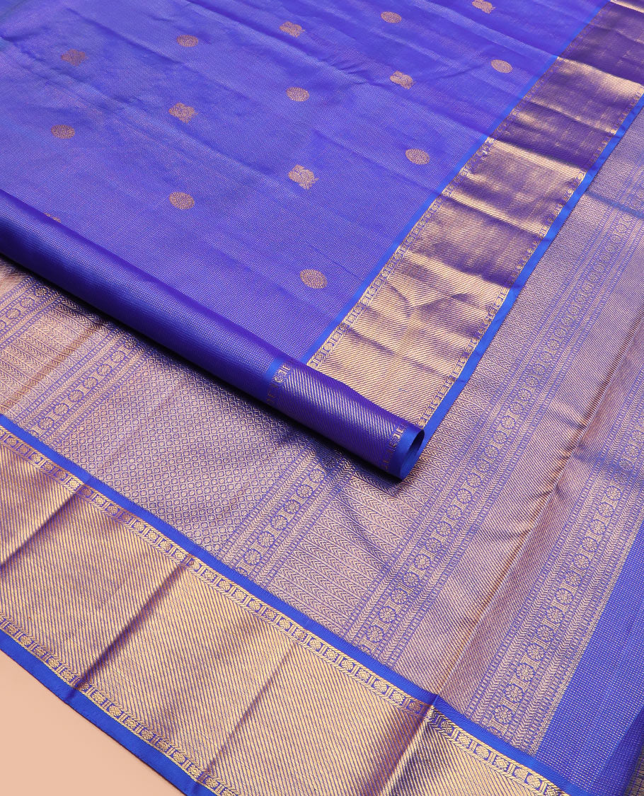 Blue mayil chakram buttas Kanchipuram silk saree, zari border of rudraksham and diamond designs, and intricate pallu