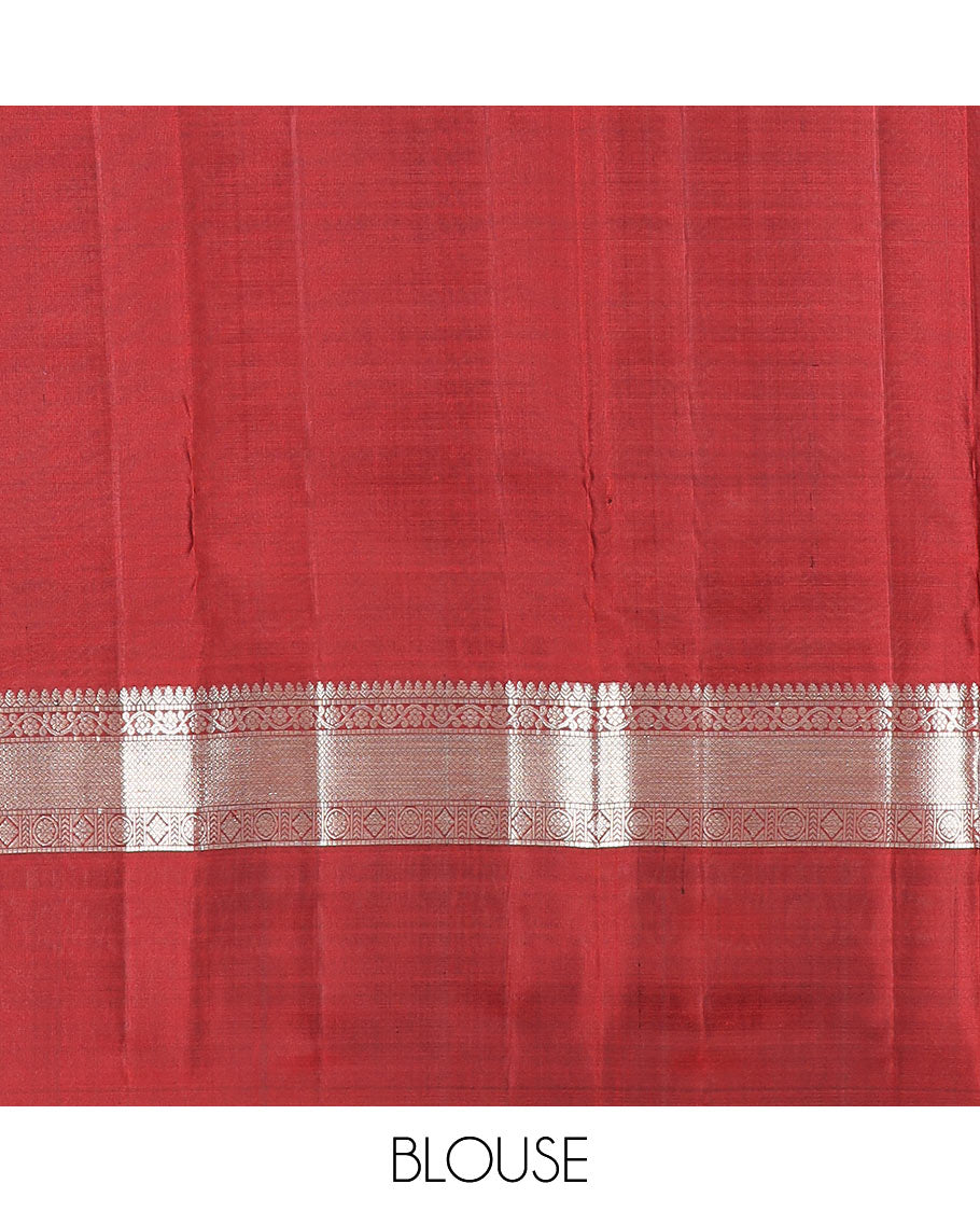 Green zari buttas Kanchipuram silk saree, contrast border of thilakam, muthu, kodi visiry, mayil kann, chakra, and diamond designs, and rudraksham motifs pallu