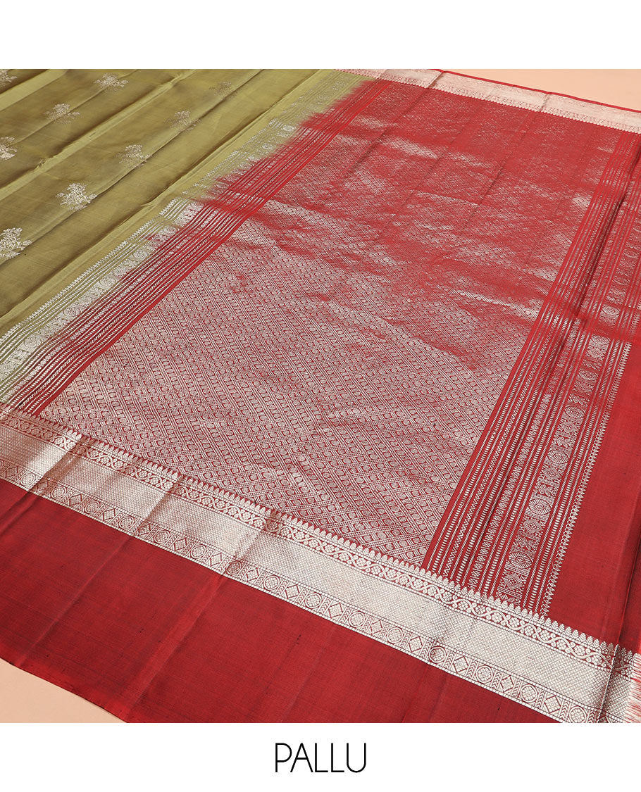 Green zari buttas Kanchipuram silk saree, contrast border of thilakam, muthu, kodi visiry, mayil kann, chakra, and diamond designs, and rudraksham motifs pallu