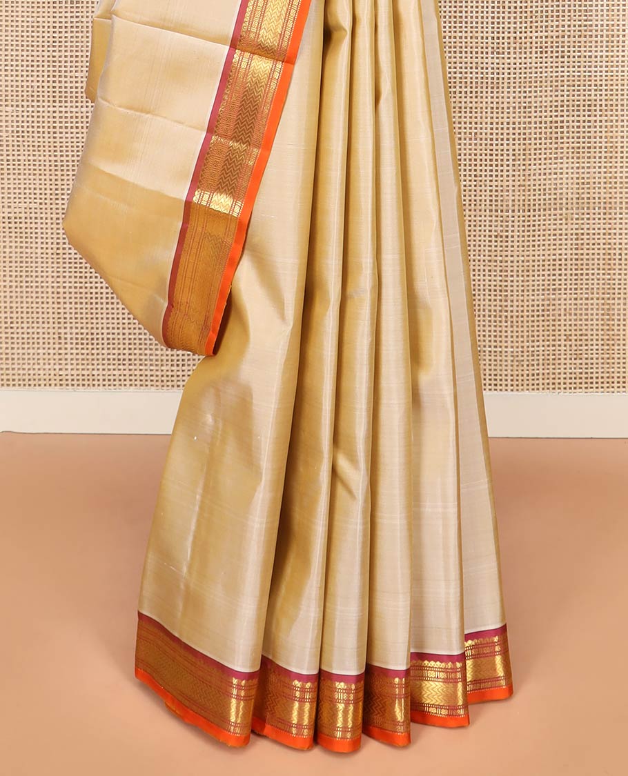 Light Sandal Plain Kanchipuram Silk Saree, Complemented by Contrast Border of Salngai, Muthu, Lavangam, and Vanki Designs, Zari Woven Pallu, and Paired with a Contrast Blouse