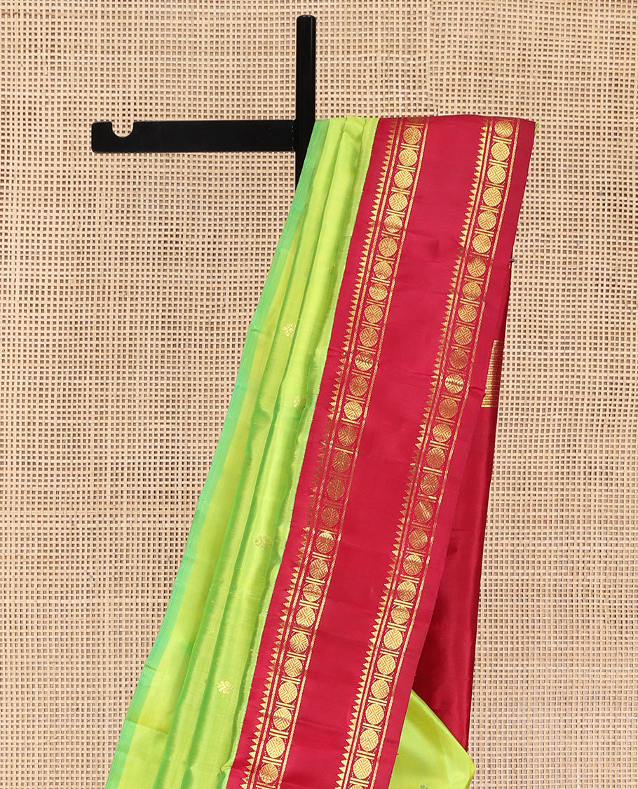 Parrot Green Kanchipuram Silk Saree, Adorned with Zari Buttas and Mayil Buttas on Its Body, Complemented by a Contrast One-Sided Korvai Border of Rekku, Banaras, and Rudraksham Designs, Pallu of Zari Designs, and Comes Without a Blouse