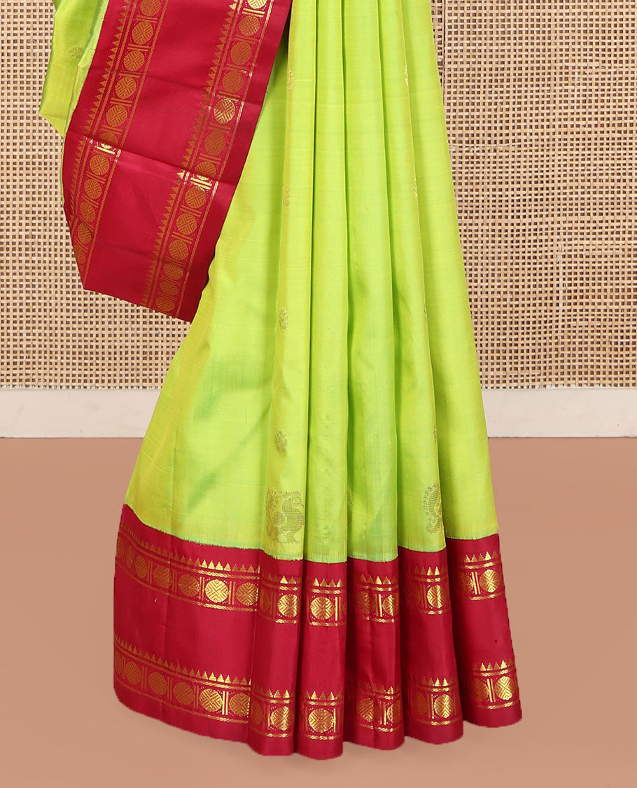 Parrot Green Kanchipuram Silk Saree, Adorned with Zari Buttas and Mayil Buttas on Its Body, Complemented by a Contrast One-Sided Korvai Border of Rekku, Banaras, and Rudraksham Designs, Pallu of Zari Designs, and Comes Without a Blouse