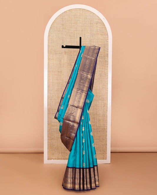 Blue zari buttas silk saree, contrast border of thilakam mokku,rettai neli,chakram,mayil kann, rudraksham & mayil & intricate pallu