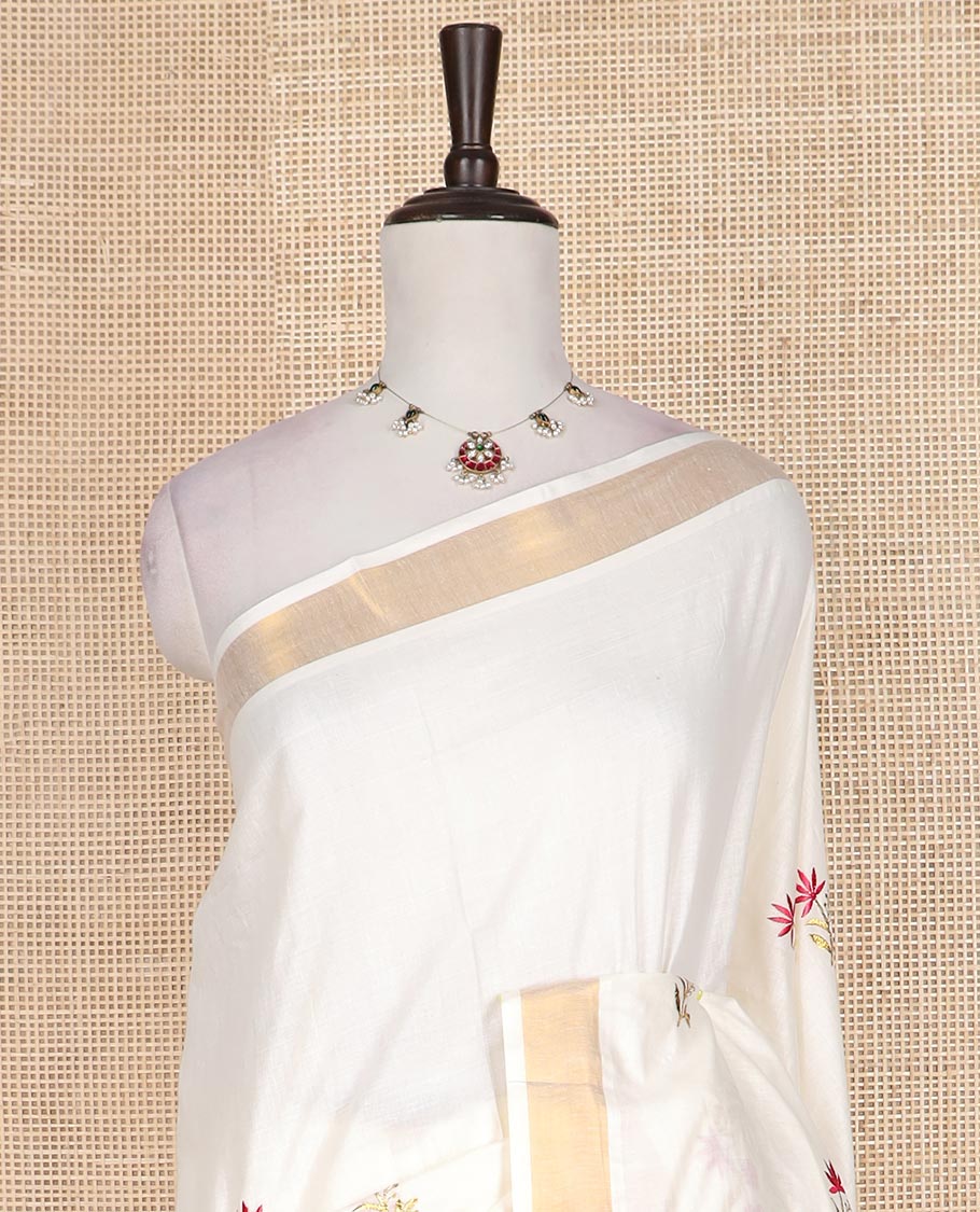 Cream floral motifs embroidered Kerala cotton saree, zari border, and floral embroidered pallu