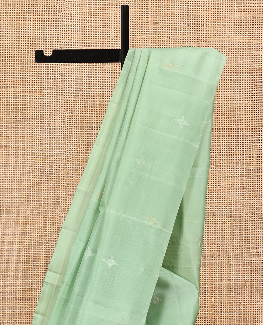 Borderless Green Mayuri Soft Silk Saree, Woven with Buttas All Over Its Body, Sparsely Sparkled Pallu, and Paired with a Matching Blouse